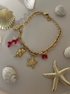 Gourmette “Trésors de la Mer” – Charms Dorés & Accents Corail