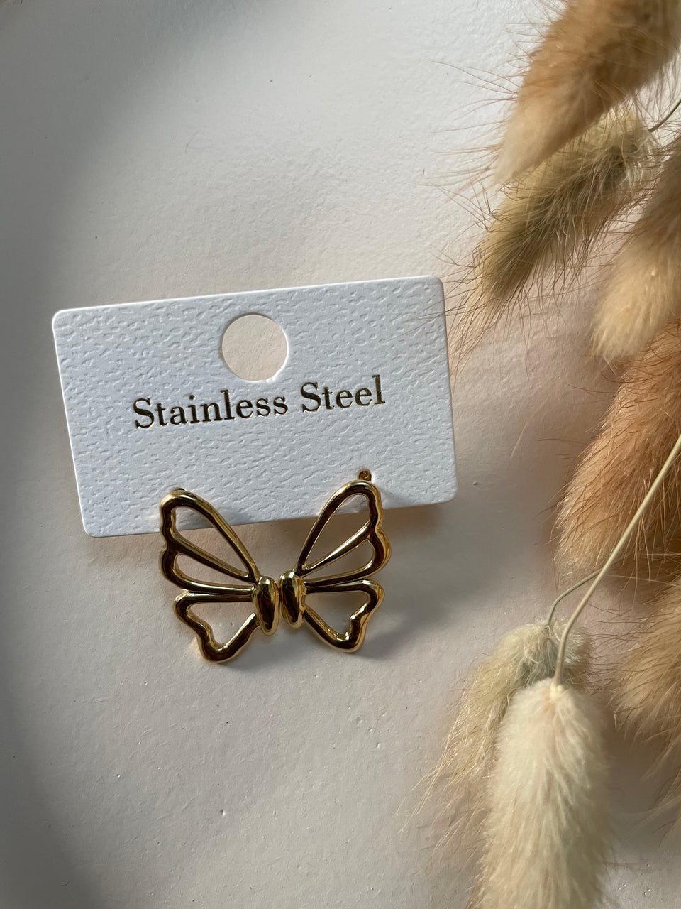 Papillonea – Boucles d’oreilles papillon dorées en acier inoxydable